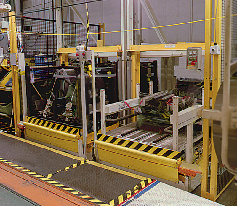 Two Over/Under units mounted side-by-side; delivering window glass to the assembly line operator.