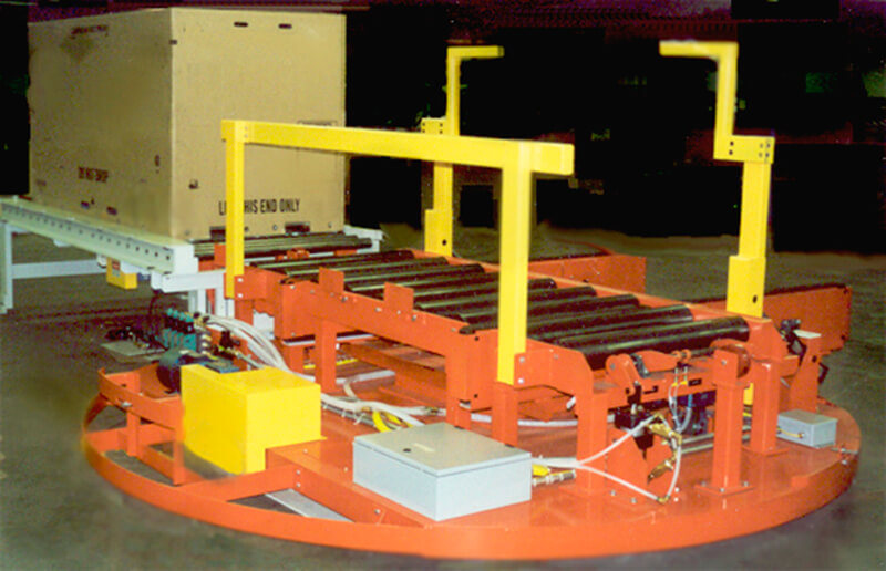 An automatic Turntable design that presents large crates in the correct orientation needed for interface with a robotic fastening operation.
