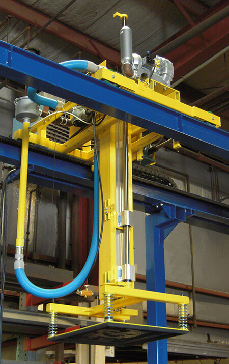 Motor driven trolley with a vacuum attachment pad. Vertical transfer is performed pneumatically.
